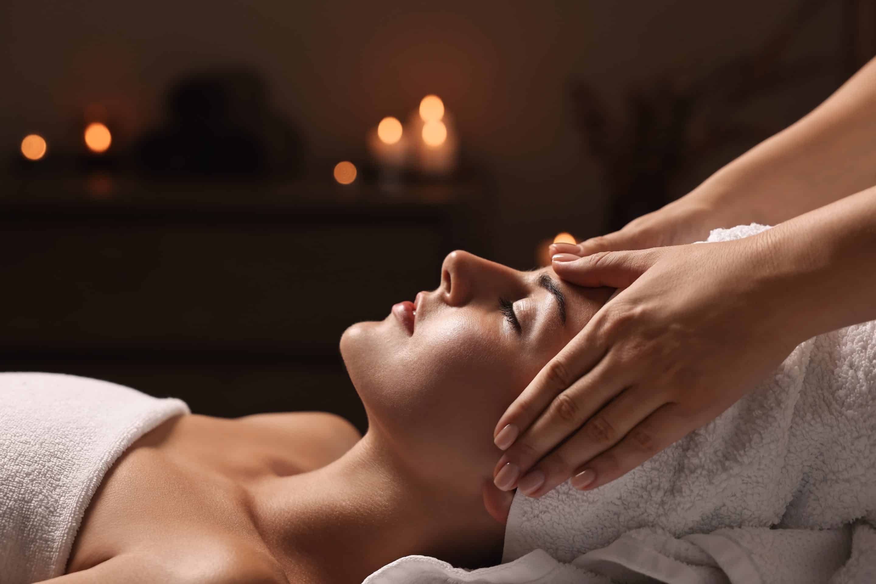 Attractive,woman,enjoying,face,massage,in,spa,salon,,closeup